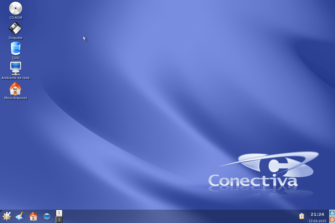 Desktop do Conectiva Linux 10 após login. 5 ícones estão na área de trabalho: CD-ROM, Disquete, Lixo, Ambiente de rede e Meus arquivos.